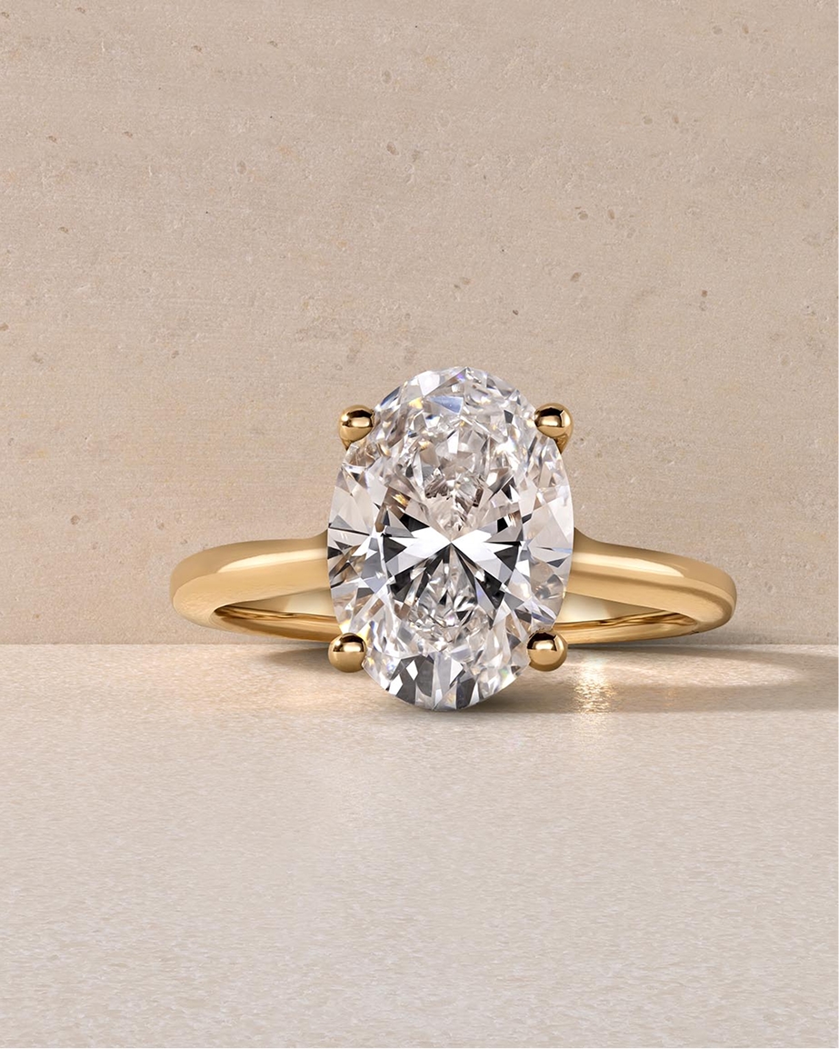 Round solitaire ring set in white gold.