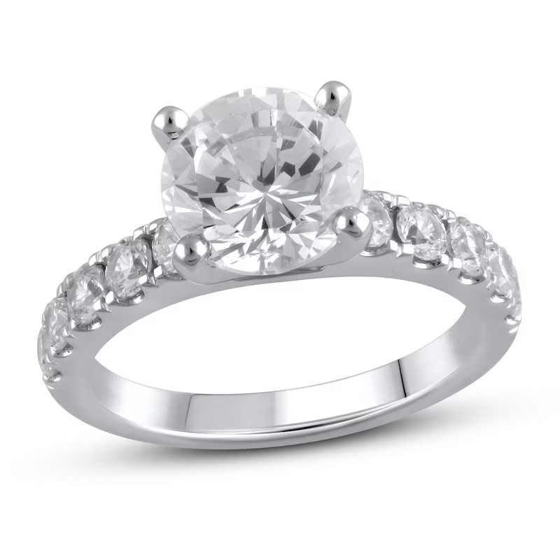 Image of a white gold round cut engagement ring. 