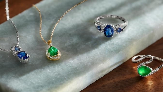 Image of gemstone jewelry featuring rings and necklaces.