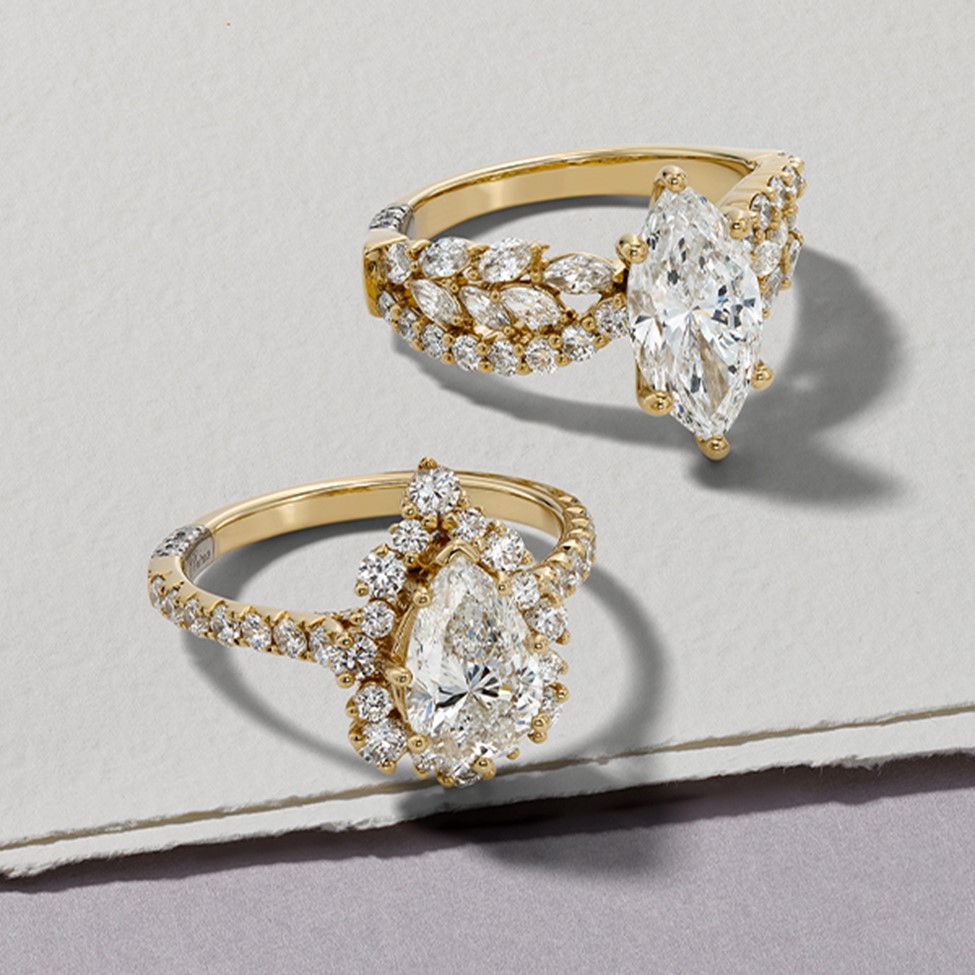 Image of two diamond rings with yellow gold.