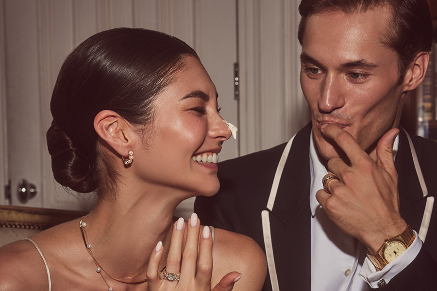 Image of a couple wearing fine jewelry.