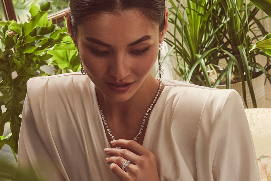 Image of a woman wearing diamond jewelry.