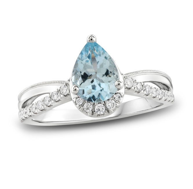 White gold ring with pear shaped aquamarine center stone.