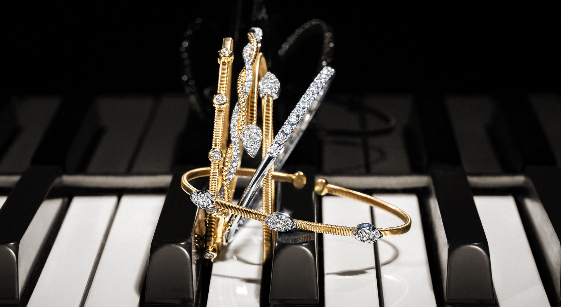Shy Corelli flexible gold and diamond bangle bracelets