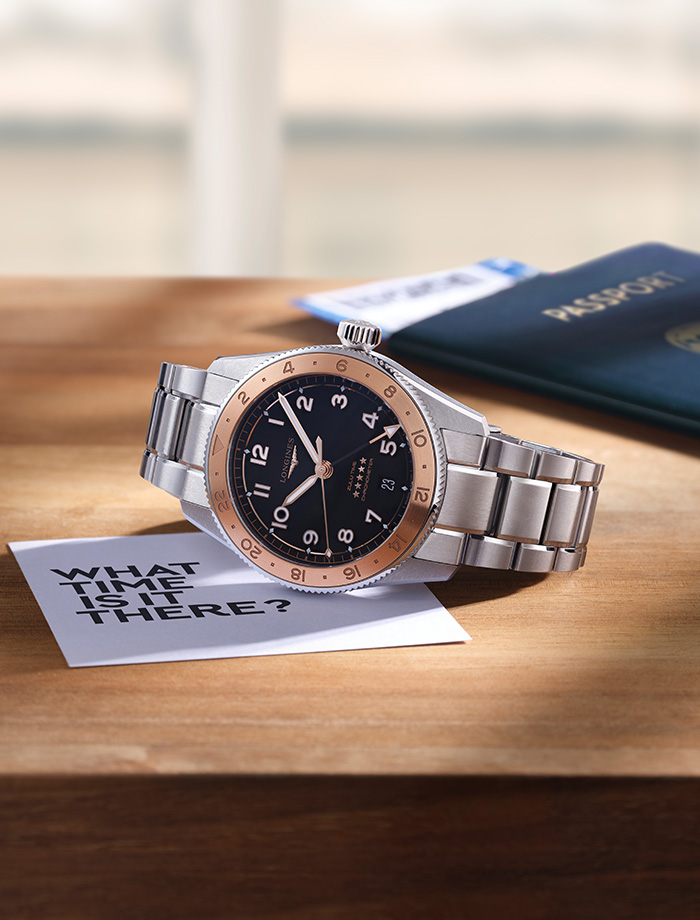 Longines Sport watch with with stainless steel bracelet and round blue dial.