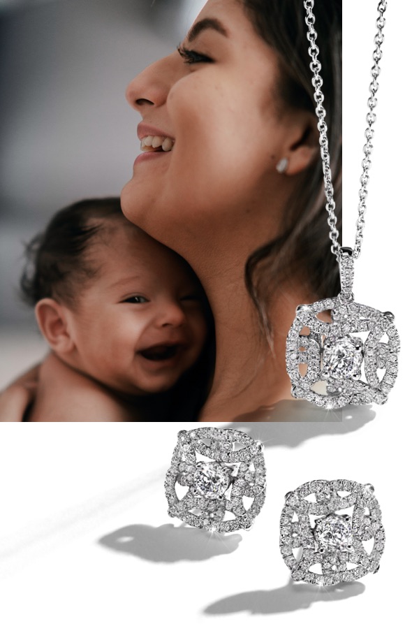 Mother smiling holding a young baby next to diamond earrings and necklace from Jared.