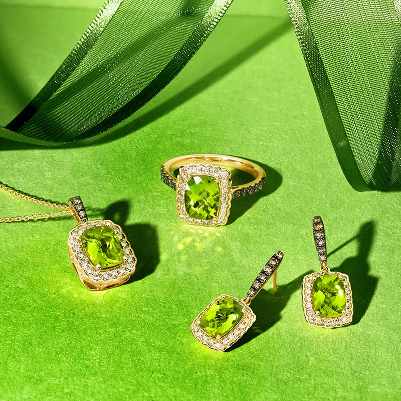 Peridot stone in tweezers