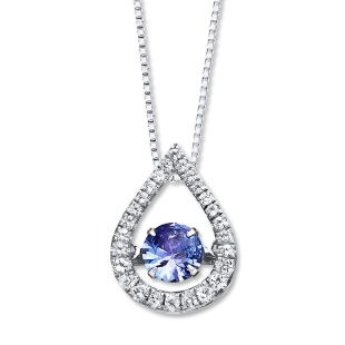 White gold necklace with pear shaped halo around a round tanzanite.