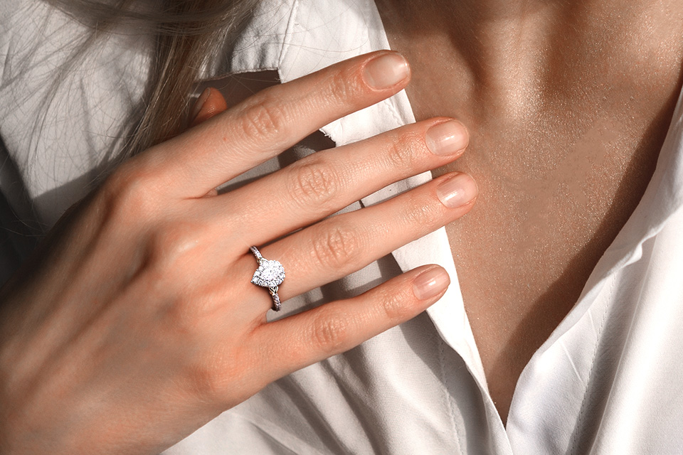 Woman's hand wearing a Y Knot engagement ring