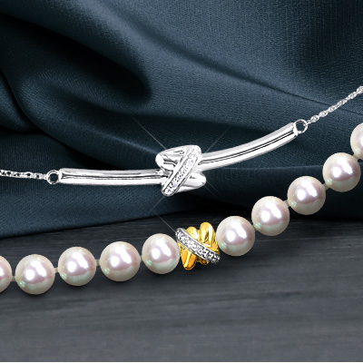 White diamond necklace set in white gold and pearl necklaces with yellow gold and white diamond accent from the Y Knot Collection