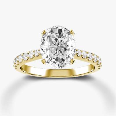Oval diamond with prong set tapered mounting in yellow gold