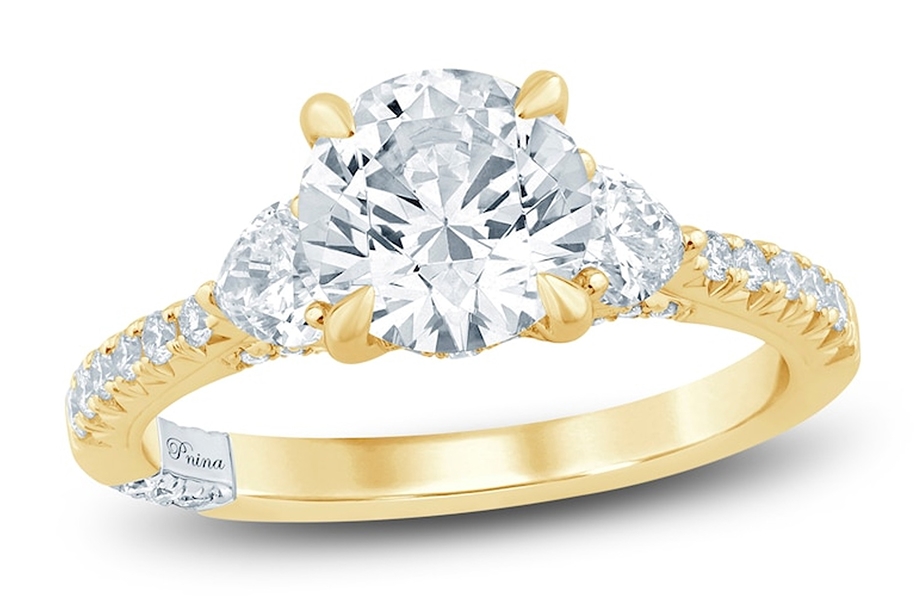 Yellow gold three stone diamond engagement ring