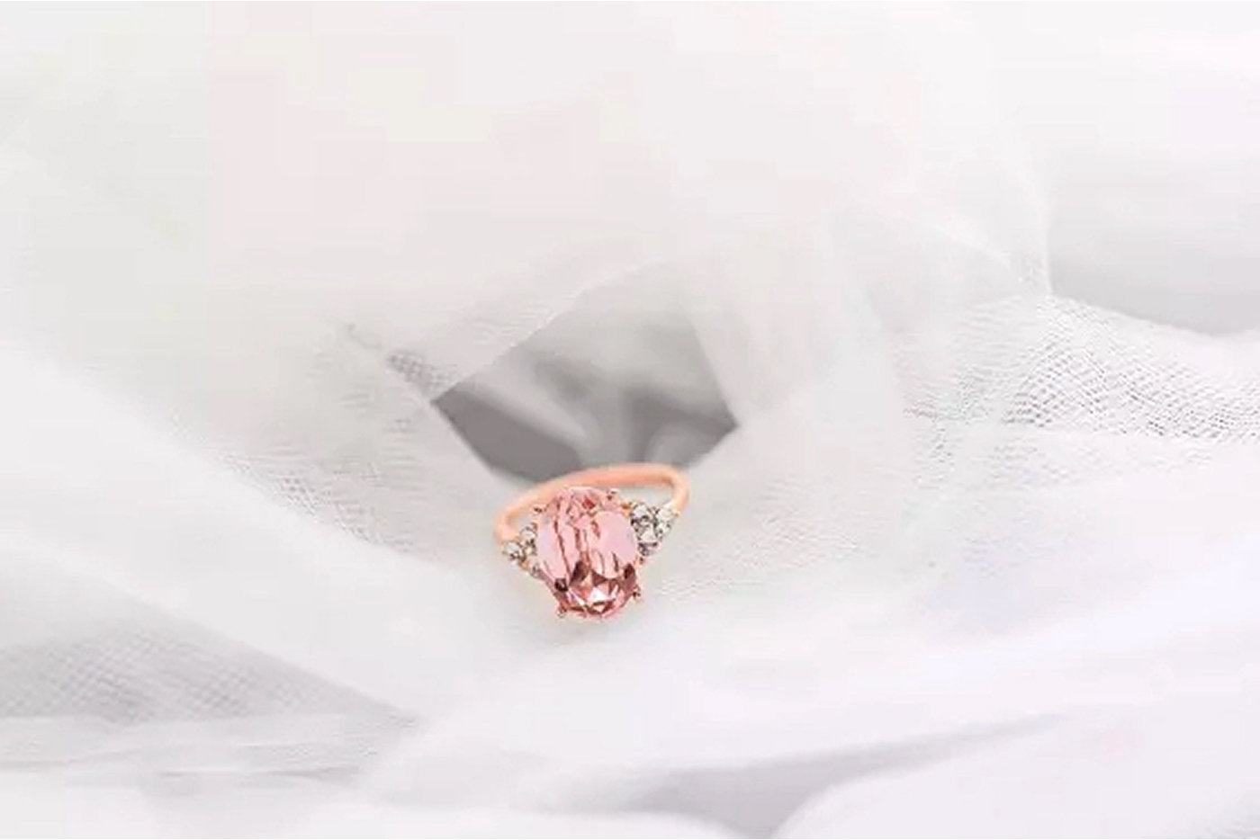 Morganite ring displayed with rose gold and diamonds