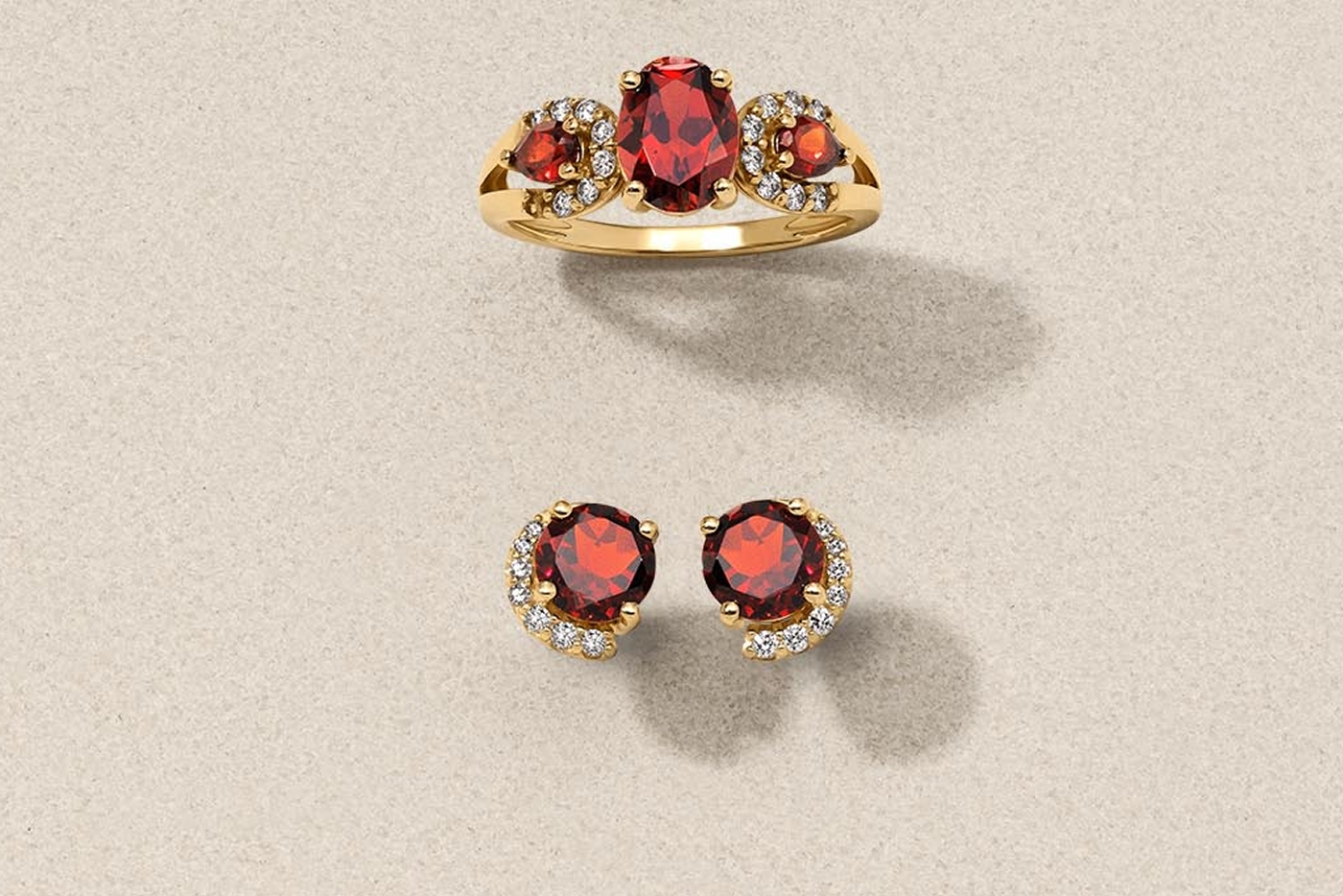 Yellow gold and diamond garnet rings and earrings