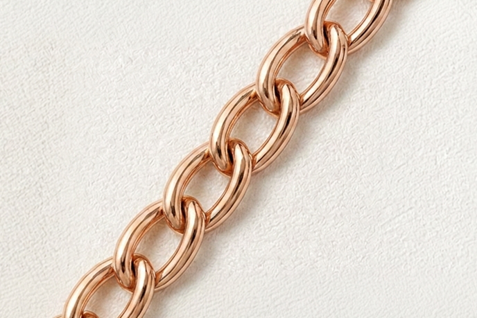 A rose gold cable necklace.