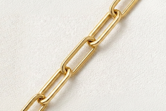 A gold paperclip necklace