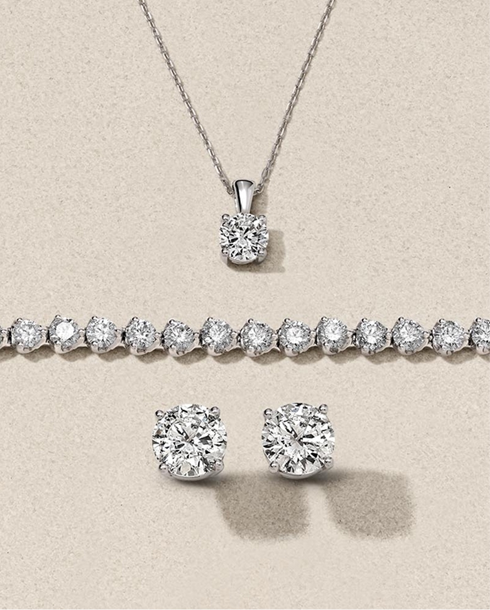 Diamond pendant necklace tennis bracelet and stud earrings