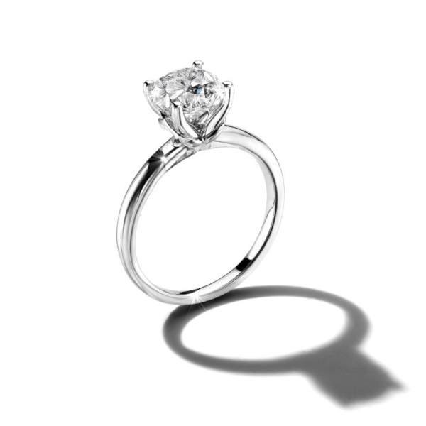 Round solitaire ring set in white gold.