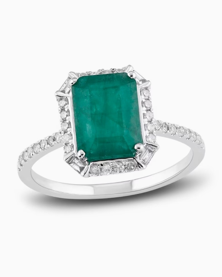 Shop engagement rings with emerald center stones.