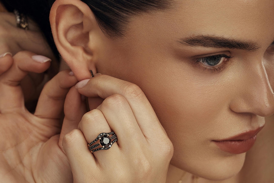 model removing earrings