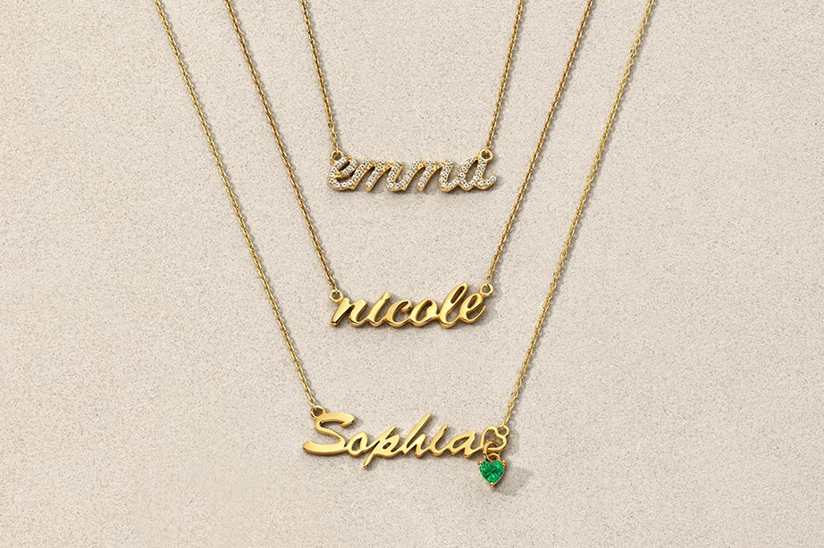 Gold and emerald nameplate necklaces