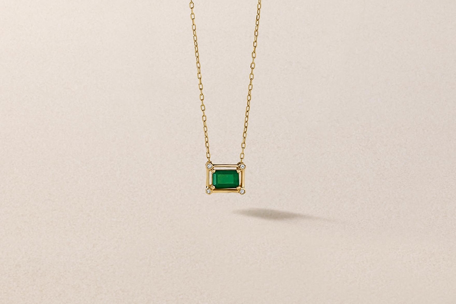 Yellow gold emerald and diamond necklace