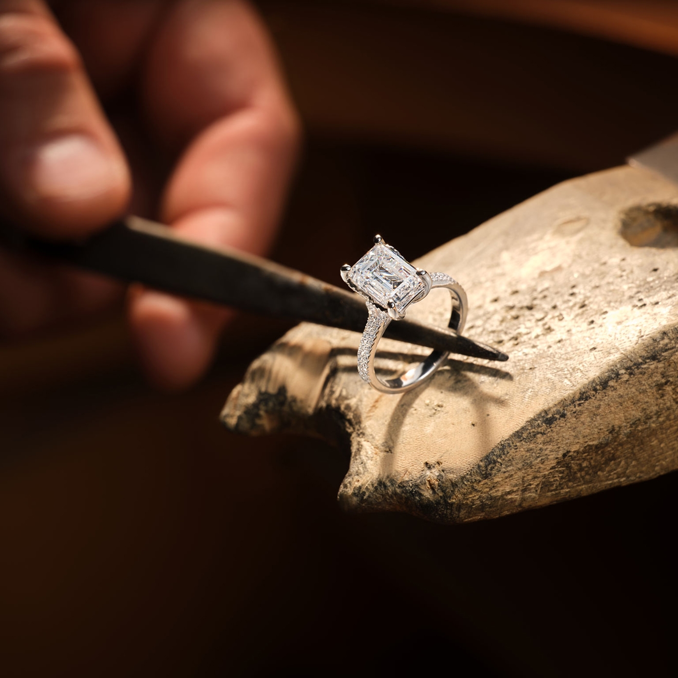 Image of a jeweler repairing a ring.