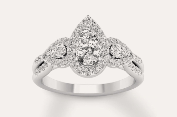 3-stone pear shaped engagement ring with large pear-shaped center diamond and two pear-shaped side diamonds on a white background.