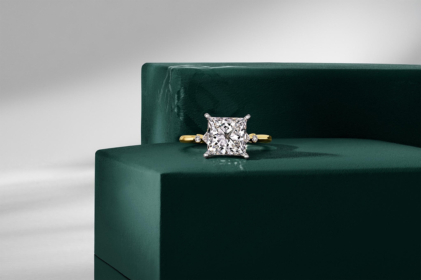 Yellow gold engagement ring with princess cut center diamond