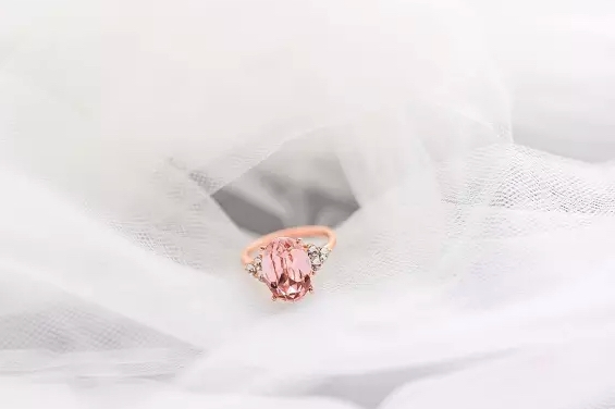 Morganite engagement ring on a white fabric