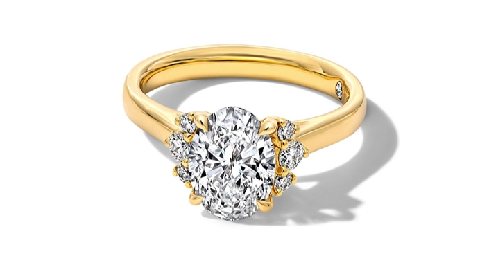 Oval diamond engagement ring with milgrain band