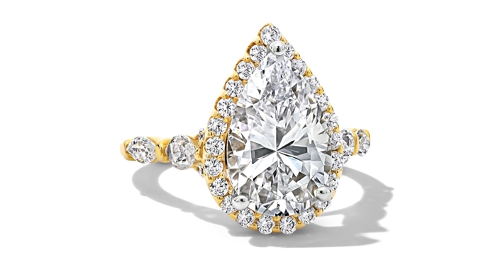 Engagement ring with pear center diamond and halo