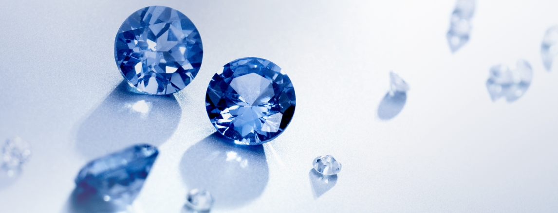 Blue round-cut gemstones scattered together