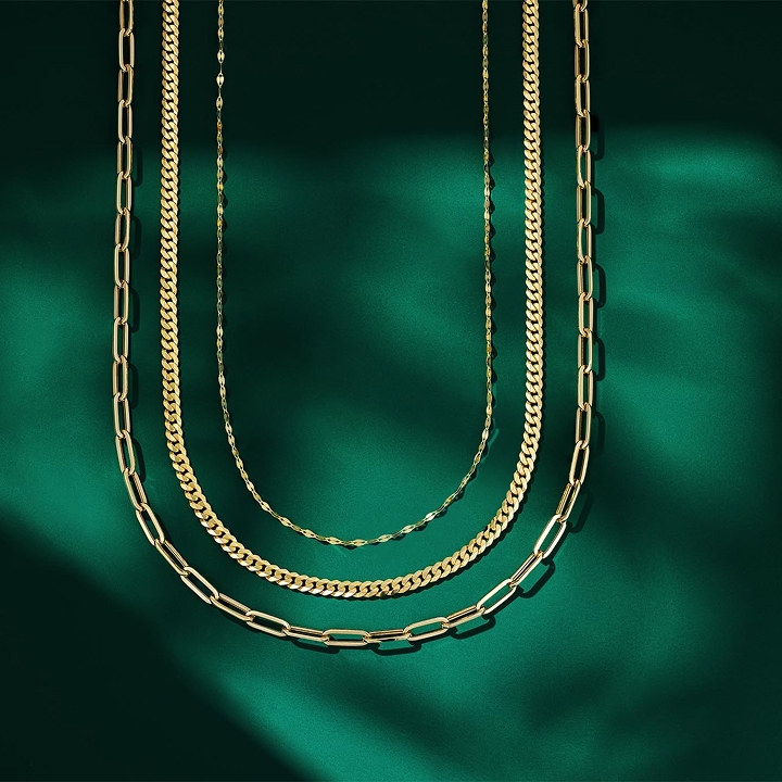 Gold chains on a green background