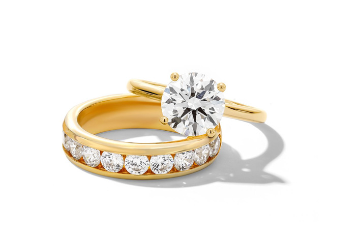Gold wedding band and engagement ring from Jared