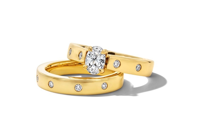 Gold wedding band and engagement ring from Jared