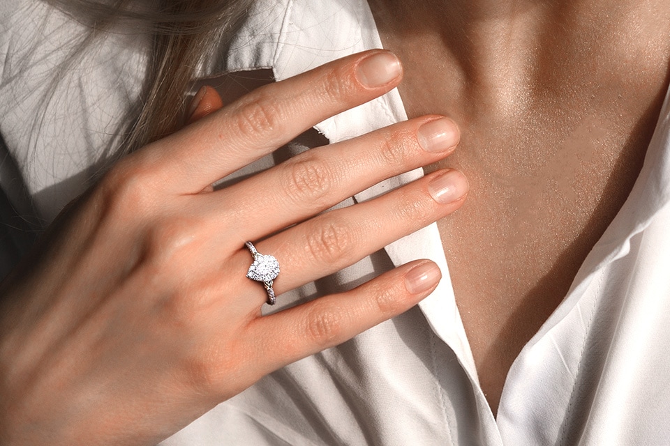 Woman's hand wearing a Y Knot engagement ring