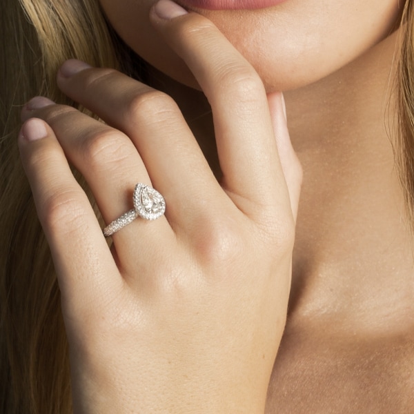 Explore options to create new from old at Jared, image of women's hand wearing a diamond ring.