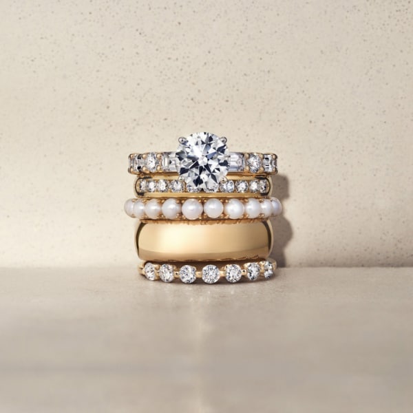 Image of gold and diamond ring stack.