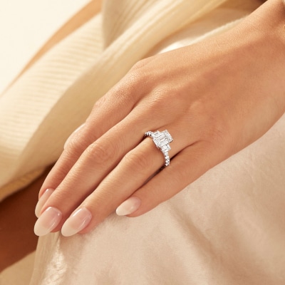 Explore ring sizing at Jared, image of women's hand with a ring on.