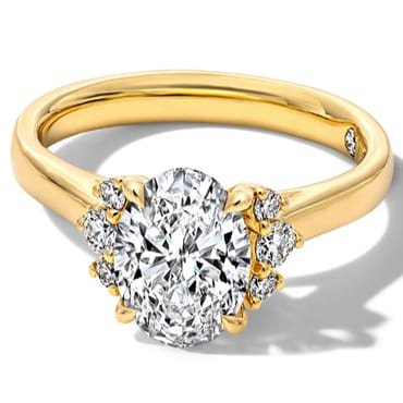 Oval diamond engagement ring with milgrain band