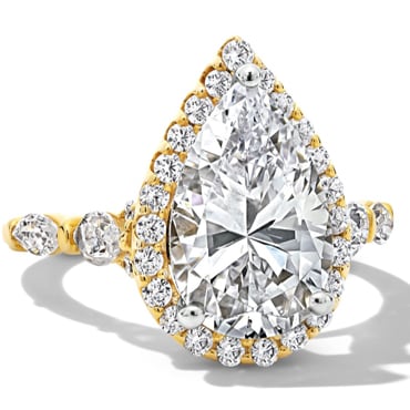 Engagement ring with pear center diamond and halo