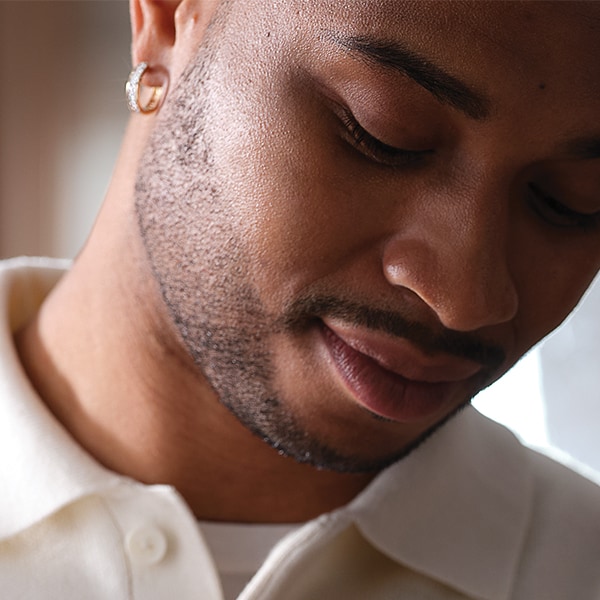 Man wearing earrings from Jared