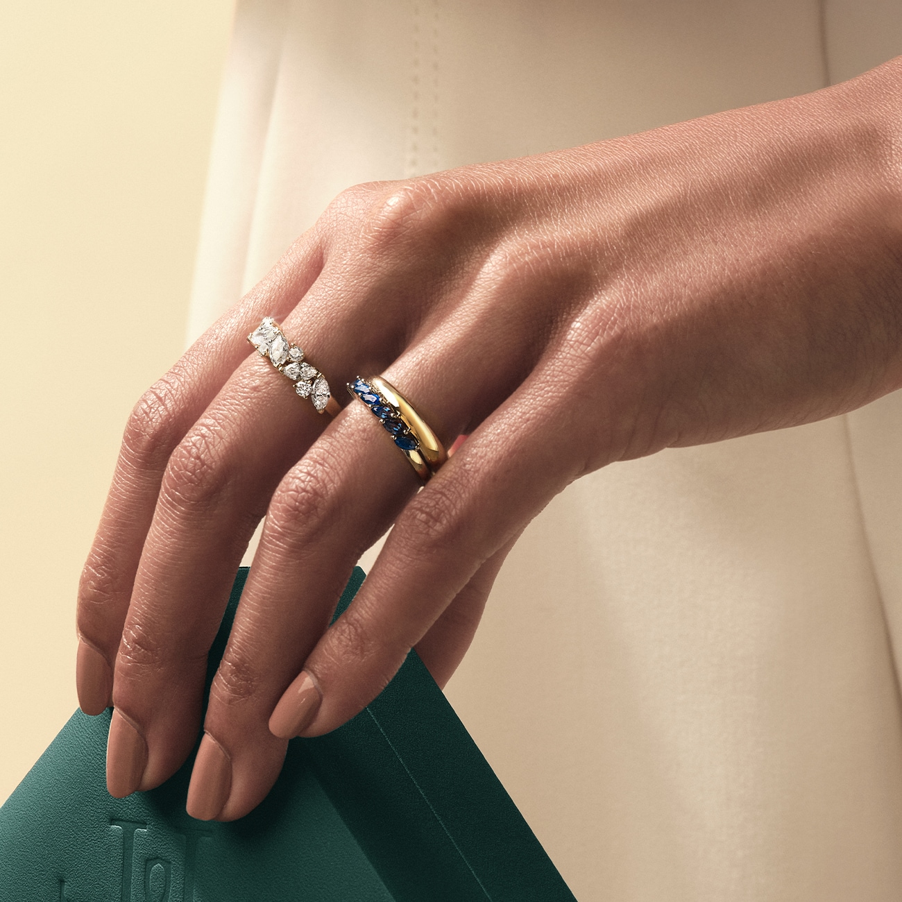 Image of woman wearing diamond rings.
