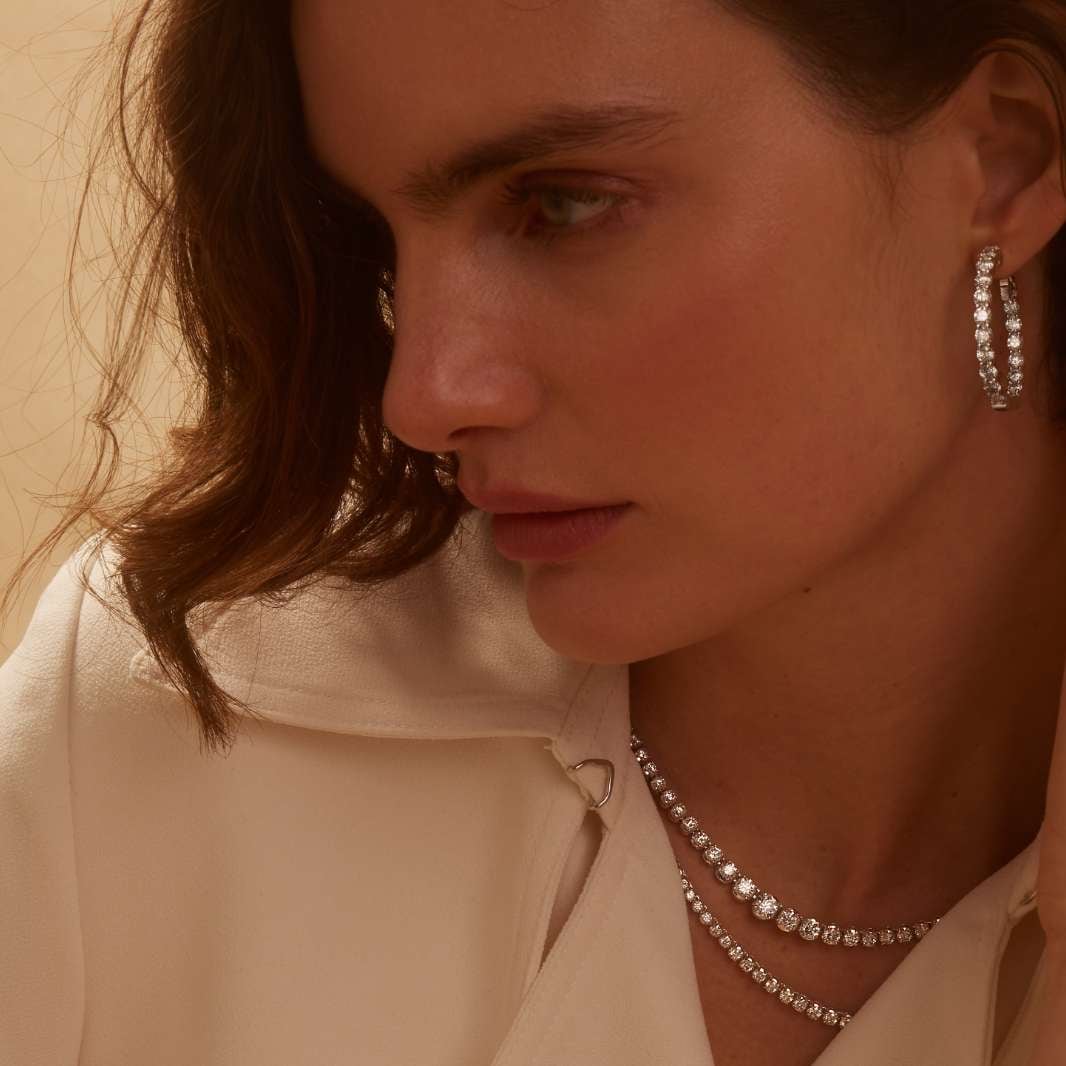 Woman wearing diamond jewelry from Jared.