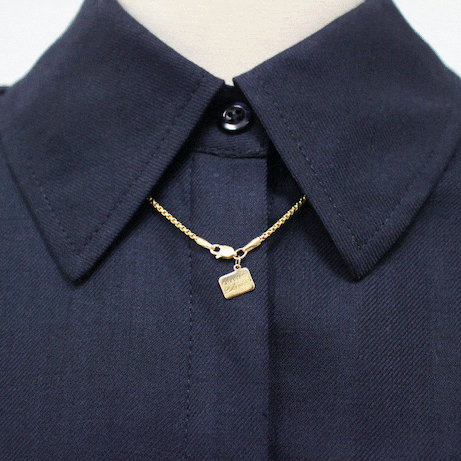 How to style Charm'd by Lulu Frost box chain with flower, locket, and key charms.