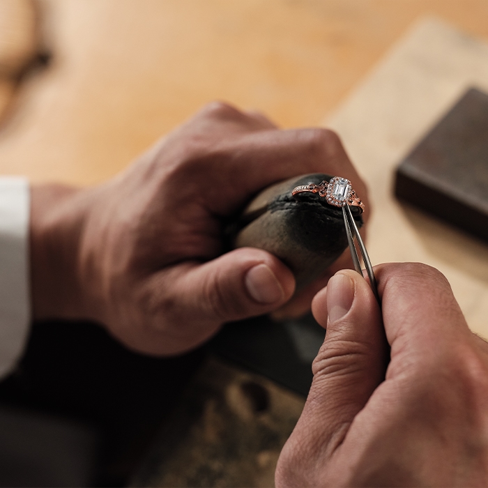 Jared repair expert setting stones in a ring