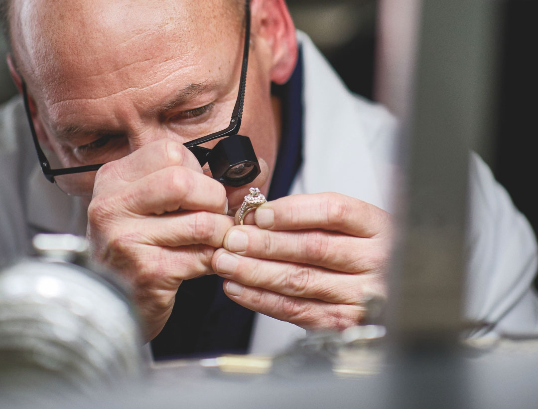 Jeweler inspecting jewelry