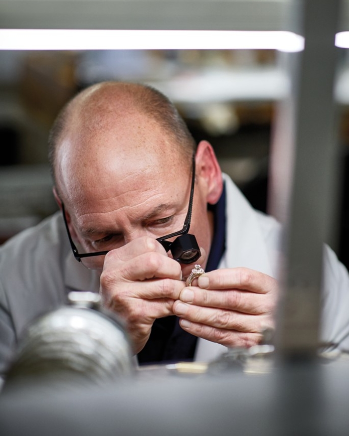 Jared jewelry expert inspecting a ring