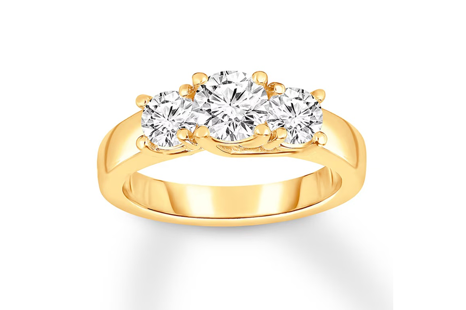 3 equal sized round diamond stones in an engagement ring